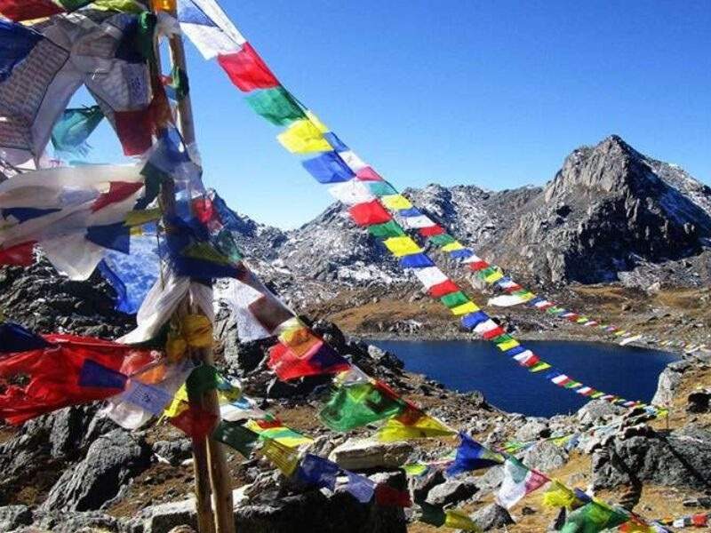 Gosaikunda Trek lake with buddhists prayer flags